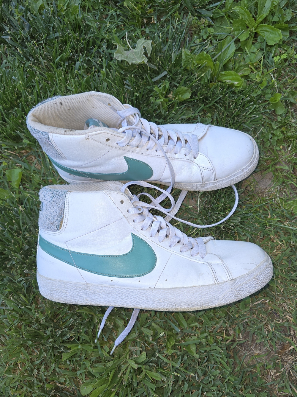 Nike White High-Top Sneakers with Teal Swoosh Accent